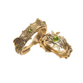 Queen‘s Ring
The image of the thornbird symbolizes unwavering strength and the resilient beauty of feminine power,
traversing forests and braving thorns in search of the ideal kingdom within the heart.
King’s Ring
The medal is engraved with the totem of the Forest Lion King—courageous, majestic, and commanding authority.
Three green “gems” represent the mysterious power drawn from the Forest Kingdom.