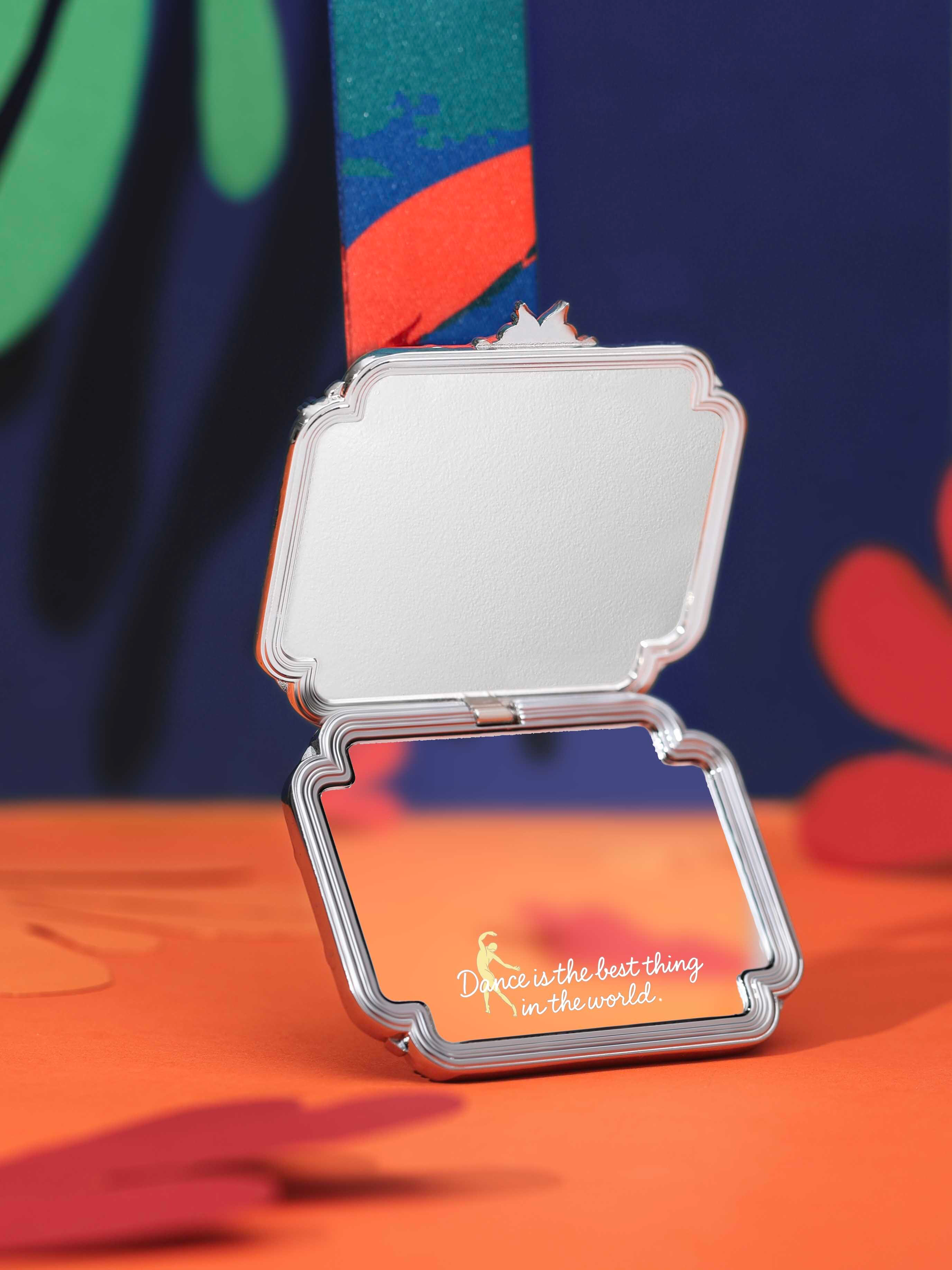 The medal can be gently opened, revealing a high-gloss polished mirror on the inside.
The mirror is inscribed with:
"Dance is the best thing in the world."
This is a “Medal of Conviction” awarded to yourself.
In moments of uncertainty or challenge, you can open it
to experience freedom, vitality, and the joy within.